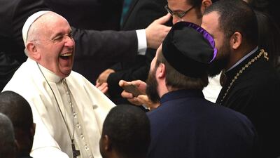 Pope Francis smiles as he meets priests in the Paul VI audience hall at the Vatican for his weekly general audience on January 16, 2019. AFP