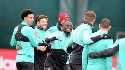 Liverpool attacker Sadio Mane, centre.