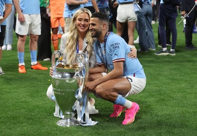 Manchester City's Riyad Mahrez with his wife Taylor Ward celebrating his team's Champions League win. Reuters