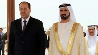 Sheikh Mohammed bin Rashid, the Vice President of the UAE and Ruler of Dubai, and Nouri al Maliki, Iraq's prime minister, stand for the national anthem in Abu Dhabi.