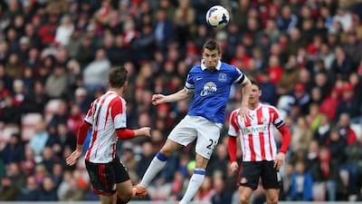 Seamus Coleman, centre, of Everton clears the ball past Fabio Borini of Sunderland during their Premier League match at Stadium of Light on April 12, 2014 in Sunderland, England. Alex Livesey/Getty Images