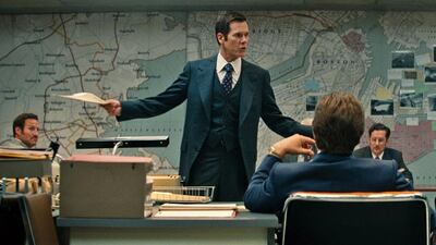 In this image released by Warner Bros Entertainment, Kevin Bacon appears in a scene from "Black Mass." Warner Bros. Entertainment via AP