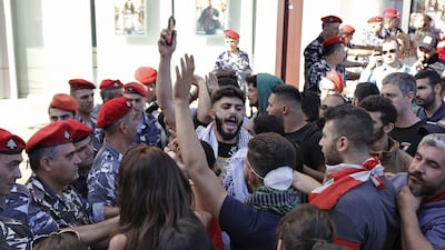 Lebanese protestors trying to reach the parliament in Beirut scuffle with security forces. AFP