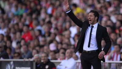 Diego Simeone has endeared himself to the Atletico Madrid fans and is seen by players as someone who can achieve the status of Sir Alex Ferguson. Pierre-Phillip Marcou / AFP