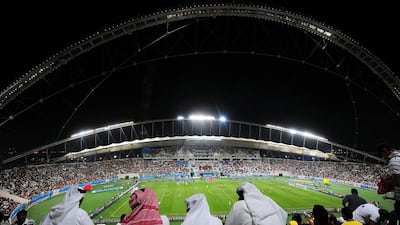 Fans shown watching a match at the Khalifa International Stadium in Doha in 2009. Owen Humphreys / PA / AP / November 14, 2009