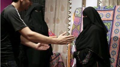 Mohy Abozeid, left, directs presenter Nahla Hashad, right, and Shaimaa Abdelhameed, second left, as they prepare to film a segment of a Ramadan program at the Maria Channel's studio in Cairo, Egypt, Monday, July 23, 2012. The first Egyptian satellite channel operated by women wearing the niqab, or face veil, launched on the first day of the holy month of Ramadan. The station manager says he hopes†the full face-veiled women†will set an†example for others†by showing a "new kind of woman" as a role model.(AP Photo/Maya Alleruzzo) *** Local Caption *** Mideast Egypt Maria Channel.JPEG-06b86.jpg