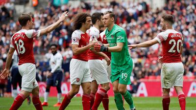 Leno celebrates with team mates after a save. Reuters