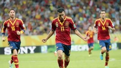 Pedro Rodriguez, centre, scored the first goal for Spain in a 2-1 win on Sunday, and could add to his tally against Tahiti. Srdjan Suki / EPA