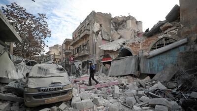 A Syrian walks on the rubble of a building following a regime air strike on Ariha town in Syria's last major opposition bastion of Idlib on January 15, 2020. AFP