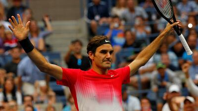 Roger Federer of Switzerland celebrates winning his second round match against Mikhail Youzhny of Russia