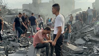 Palestinians look for survivors following Israeli air strikes in Nusseirat refugee camp in the Gaza Strip. AP