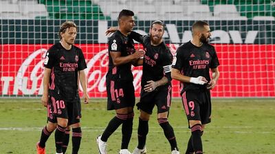 Sergio Ramos, second right, celebrates after scoring his side's third goal. AP
