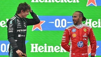 Kimi Antonelli, left, and Lewis Hamilton on the podium. AFP