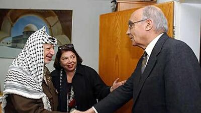 José Saramago, right, meets the Palestinian leader Yasser Arafat in the West Bank city of Ramallah in 2002. The Palestinian Authority's ambassador in Paris, Leila Shahid, is also seen.