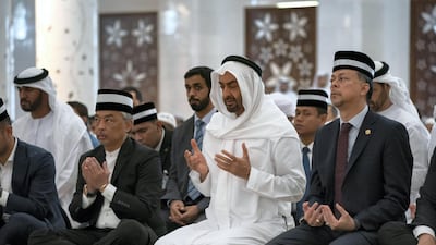 Sheikh Mohamed bin Zayed and Sultan Abdullah, attend Friday prayers at Sheikh Zayed Grand Mosque.
