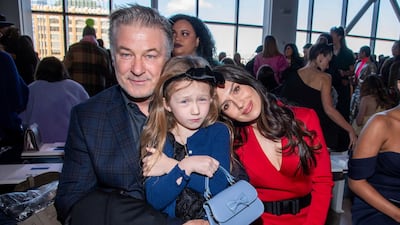 Alec Baldwin, Carmen Baldwin and Hilaria Baldwin attend the Badgley Mischka show at New York Fashion Week on February 8, 2020. AP