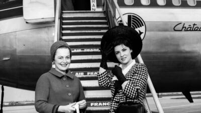 US actress Olivia de Havilland, left, and Lollobrigida at a Parisian airport in 1963. AFP