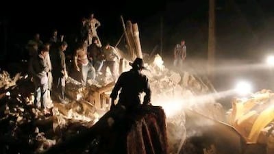 Rescue workers search for survivors after twin earthquakes hit north-western Iran in August.