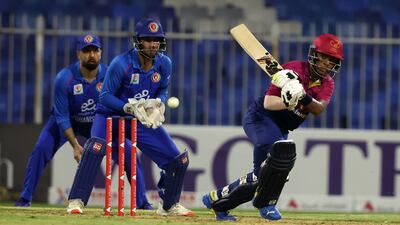 Ethan D'Souza of the UAE plays a shot against Afghanistan.