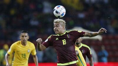 Venezuela’s Adalberto Penaranda heads the ball. Ariana Cubillos / AP Photo