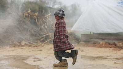 A Syrian girl out walking in a refugee camp in Ghouta on the outskirts of Damascus. Amer Al Mohibany / AFP Photo