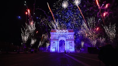 Fireworks illuminate the sky over the Arc de Triomphe during New Year's celebrations in Paris, on January 1, 2023. Reuters