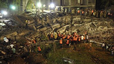 Rescue workers conduct a search operation for survivors at the site of a collapsed 12-storey building on the outskirts of Chennai. Babu / Reuters