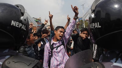 Nepalese citizens block traffic and shout slogans against the government on April 29, 2015, as they protest the slow pace of aid delivery following the earthquake. Niranjan Shrestha/AP Photo