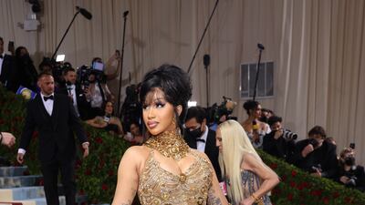 Rapper Cardi B wearing a gold gown. EPA