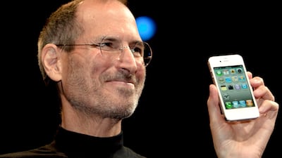 Steve Jobs, chief executive officer of Apple Inc., unveils the iPhone 4 during his keynote address at the Apple Worldwide Developers Conference (WWDC) in San Francisco, California, U.S., on Monday, June 7, 2010. Jobs introduced the redesigned iPhone 4 today, delivering a 24 percent thinner body and 100 new features as mobile competitors including Google Inc. work to usurp the smartphone's popularity. Photographer: David Paul Morris/Bloomberg *** Local Caption *** Steve Jobs 685810.jpg