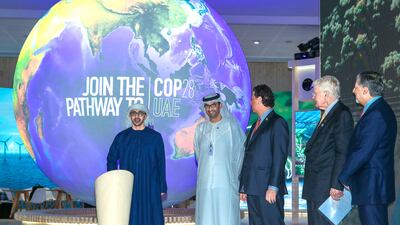 Sheikh Abdullah bin Zayed, Minister of Foreign Affairs and International Co-operation, unveils the Cop28 logo with President-designate Dr Sultan Al Jaber, Minister of Industry and Advanced Technology, at Abu Dhabi Sustainability Week. Victor Besa / The National
