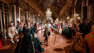 Guests in baroque style costumes in the Hall of Mirrors at the Chateau de Versailles Palace during the sixth edition of the Fetes Galantes fancy dress evening. Tickets cost more than €500 and guests can wander through the private apartments of the chateau, which is a World Heritage site and one of France's biggest tourist attractions. AFP