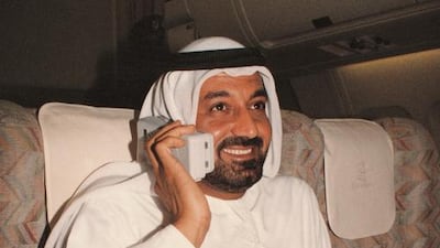 Sheikh Ahmed holds a phone onboard an Emirates flight in 1993. In 1992, Emirates became the first airline to install video systems in all seats in all classes throughout its Airbus fleet. In the same year it started flights to Charles de Gaulle in Paris and opened an exclusive Emirates terminal at Dubai International Airport. It also became the first airline to order a $20 million Airbus full-flight simulator. In 1993 it became the first airline to introduce telecommunications on all of its Airbus aircraft – in all three classes. The following year it was the first airline to equip an Airbus fleet with an on-flight fax facility. Courtesy Emirates