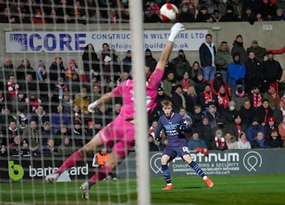 Manchester City's Cole Palmer - an academy teammate of Liam Delap - scores against Swindon Town in the FA Cup in January, 2022. AP