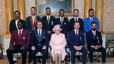 Queen Elizabeth II sits with the 10 captains of the sides competing at the Cricket World Cup 2019. AP Photo
