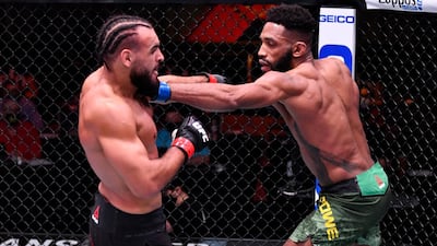 Phil Rowe, right, throws a punch to Gabe Green in their welterweight fight during the UFC 258 event at UFC APEX in Las Vegas, Nevada. Jeff Bottari / Zuffa LLC / UFC