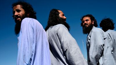 Taliban prisoners wait to be released from the Bagram prison, next to the US military base in Bagram on May 26. AFP