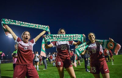 Natalie Abu Dayyeh, right, with Palestinian teammates after a match in Ireland in 2024. Getty Images