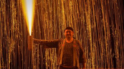 Sparks fly from one participant's Tezutsu hanabi. AFP