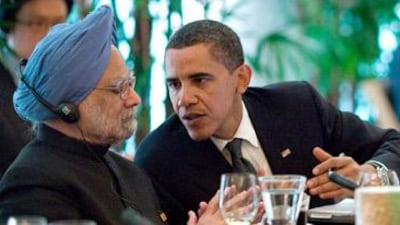 The prime minister of India, Dr Manmohan Singh, talks with US President Barack Obama at a G20 working dinner in Pittsburgh last September.