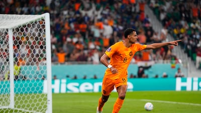 Cody Gakpo celebrates scoring the opening goal against Senegal. AP
