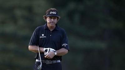 Phil Mickelson reacts to a missed chip into the 18th hole during the fourth round of the US Open. Brendan Smialowski / AFP