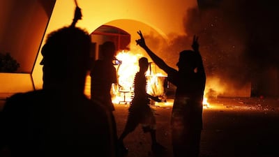 Benghazi residents set fire to the headquarters of Ansar Al Sharia on September 21, 2012, days after a deadly attack on the US consulate in the city that was blamed on the Libyan extremist group. Asmaa Waguih / Reuters