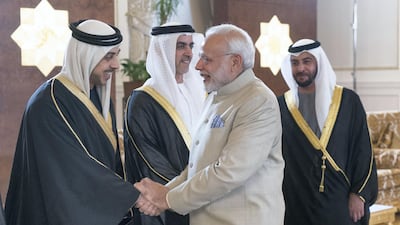 ABU DHABI, UNITED ARAB EMIRATES - February 10, 2018: HH Sheikh Mansour bin Zayed Al Nahyan, UAE Deputy Prime Minister and Minister of Presidential Affairs (L), receives HE Narendra Modi Prime Minister of India (R), at the Presidential Airport. Seen with HH Lt General Sheikh Saif bin Zayed Al Nahyan, UAE Deputy Prime Minister and Minister of Interior (back) and HH Sheikh Hamdan bin Zayed Al Nahyan, Ruler’s Representative in Al Dhafra Region (back R). ( Rashed Al Mansoori / Crown Prince Court - Abu Dhabi ) ---