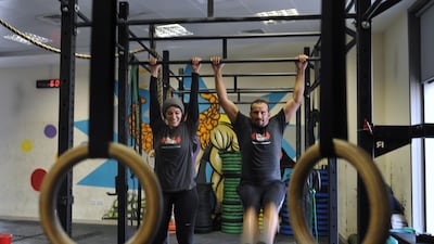 Newlyweds Mahra Al Samnan and her husband, Cristian Garcia, met at Code Crossfit while working out at the gym. The couple plan to stay fit during the Ramadan holiday by working out. Delores Johnson / The National