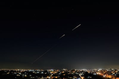 Iranian missiles fly towards Israel, as seen from Hebron, in the Israeli-occupied West Bank, March 5, 2026. Reuters