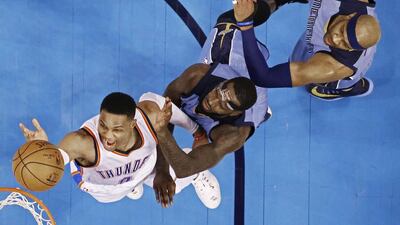Memphis Grizzlies players JaMychal Green, centre, and Vince Carter, right, try to block a shot against Oklahoma City Thunder guard Russell Westbrook, left, in the first half of the NBA basketball game between the Memphis Grizzlies and the Oklahoma City Thunder at the Chesapeake Energy Arena in Oklahoma City, Oklahoma, USA. Larry Smith / EPA