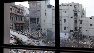 Rescue workers at the site. Mr Salam said the “humanitarian disaster” was the result of "years of accumulated neglect”. Reuters