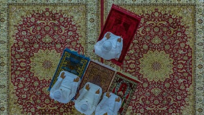 In Al Ain, three family members performing the Asr prayer at home, following the closure of mosques due to the pandemic. Taken by Emirati photographer Salem Sarhan, this work is the winner of the National Geographic Abu Dhabi and Almarai’s 2020 ‘Moments’ competition. Photo by Salem Sarhan.