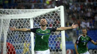 Gareth McAuley, centre, of Northern Ireland celebrates after scoring. CJ Gunther / EPA